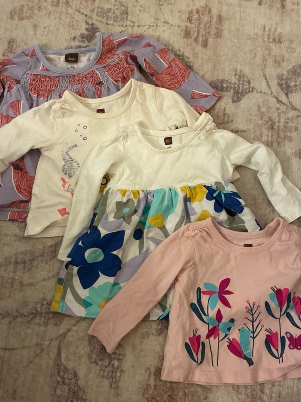 Set of four long sleeved baby shirts